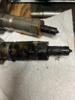 #7 and # 5 injectors side by side.jpg